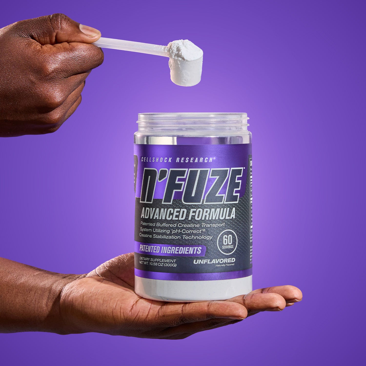 Person holding a container of N'Fuze supplement with a scoop of powder against a purple background